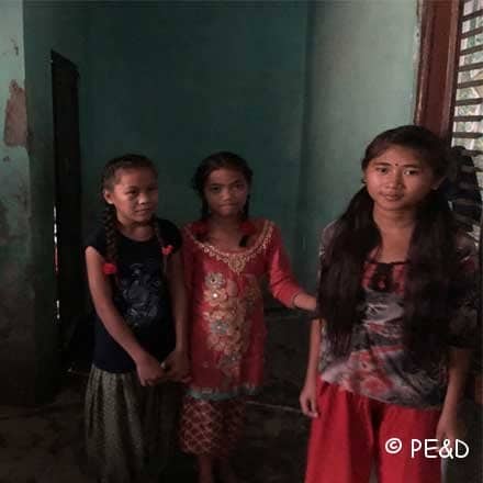 Girls standing in room