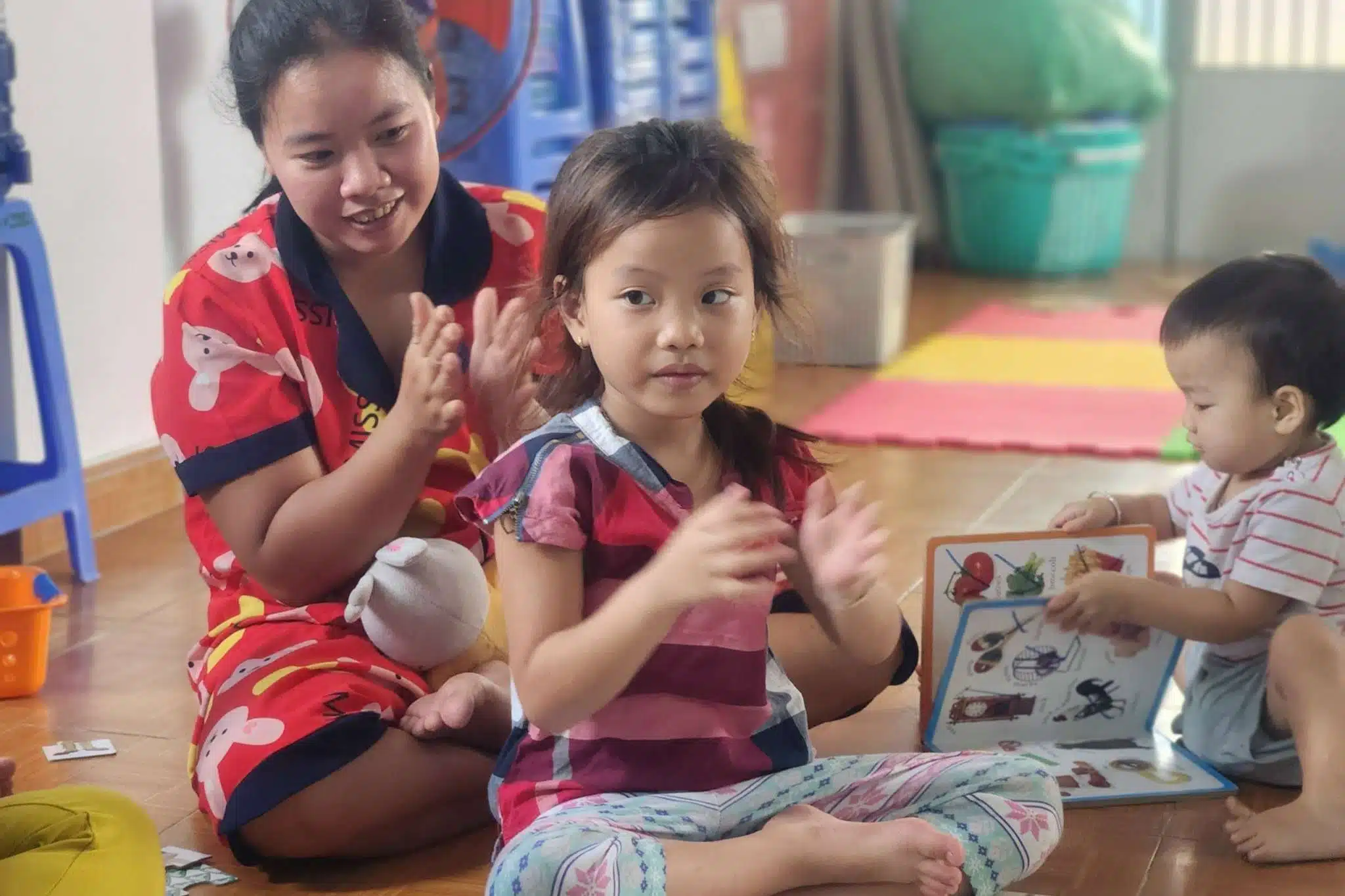 A mother and daughter at a children's club in Vietnam