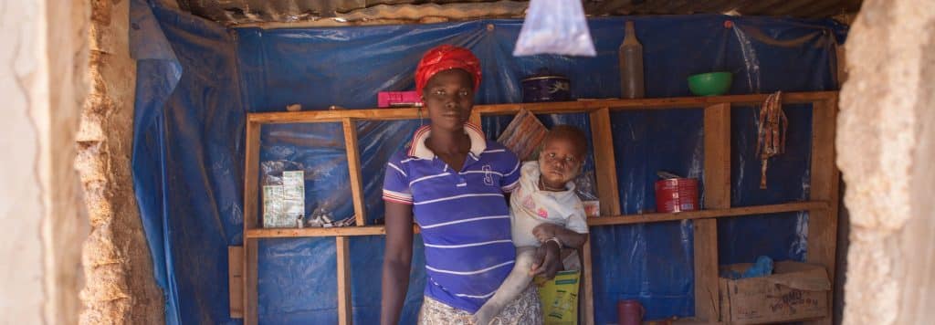 A mother and child in their home in Burkina Faso