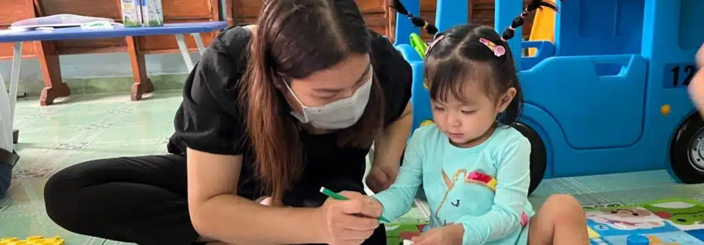 A mother and her little girl at a children's club in Vietnam