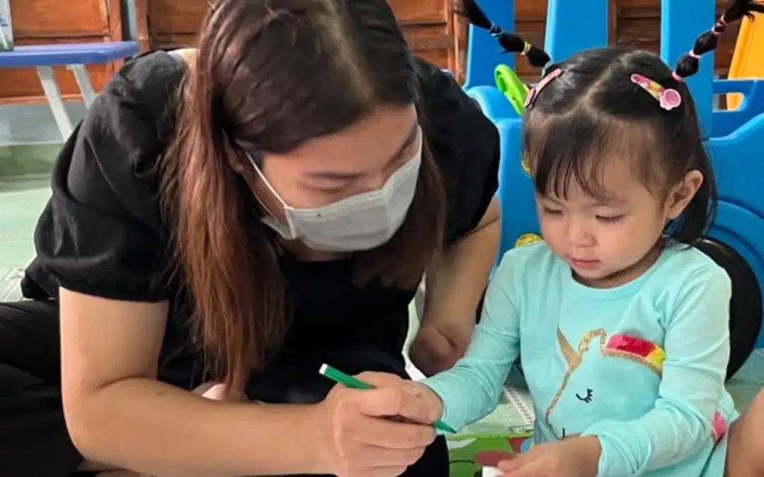 A mother and her little girl at a children's club in Vietnam