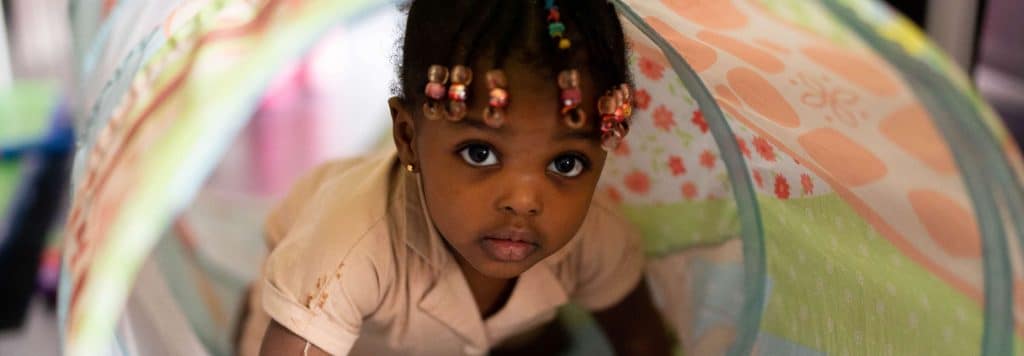 A baby plays during an early-learning workshop