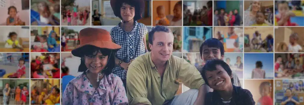 Portrait of Robert Holland with children in Vietnam