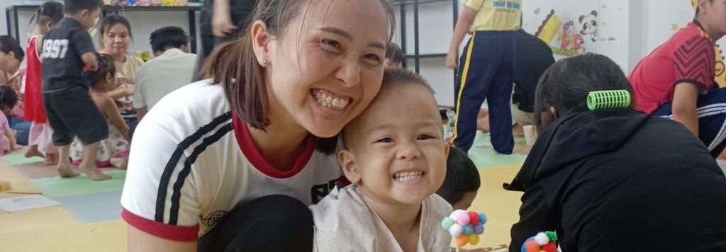 A mother and her son at the Planète Enfants & Développement Children's Club in Vietnam