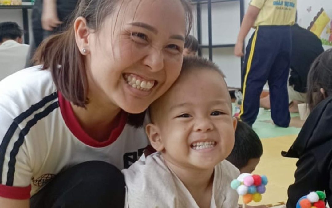 A mother and her son at the Planète Enfants & Développement Children's Club in Vietnam