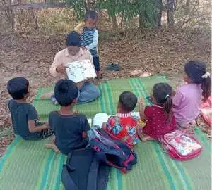 A teacher organizes activities with the children.
